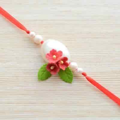 Buy Strands Elegant Pansy Scuplted Flower Rakhi with Pearl for Brother