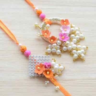 Buy Strands Elegant Pearl and Sculpted Flower Lumba Rakhi Gift Set