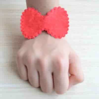 Buy Strands Red Bow Hand Cuff Contemporary Rakhi