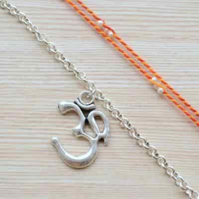 Buy Strands Sacred Mauli Rakhi with Silver Om Bracelet Gift Set
