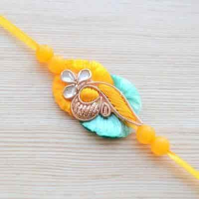 Buy Strands Traditional Aqua Blue and Yellow Rakhi for Brother