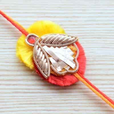 Buy Strands Traditional Red and Yellow Flower Rakhi for Boys or Men