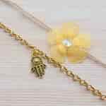 Buy Strands Chiffon Layered Flower Rakhi with Golden Hamsa Bracelet