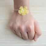 Strands Chiffon Layered Flower Rakhi with Golden Hamsa Bracelet