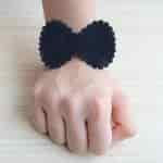Strands Contemporary Black Bow Hand Cuff Stretch Bracelet Rakhi