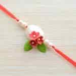 Strands Elegant Pansy Scuplted Flower Rakhi with Pearl for Brother