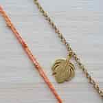 Strands Handmade Rakhi with Gold Plated Peacock Feather Bracelet