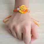 Strands Marigold Inspired Saffron and Yellow Rakhi Set for Brother